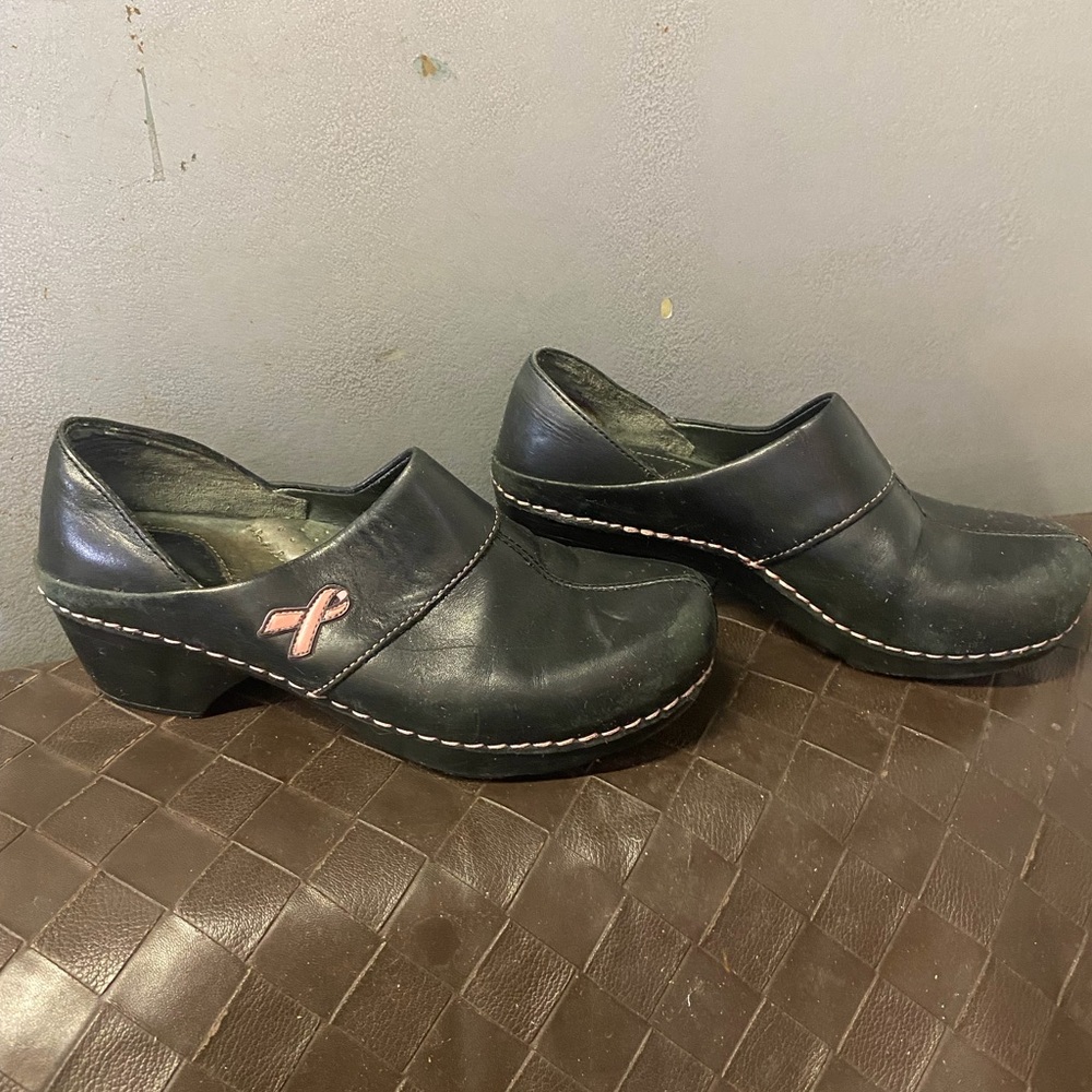 Dansko Black Leather Slip-On Clogs with Pink Ribbon Accent